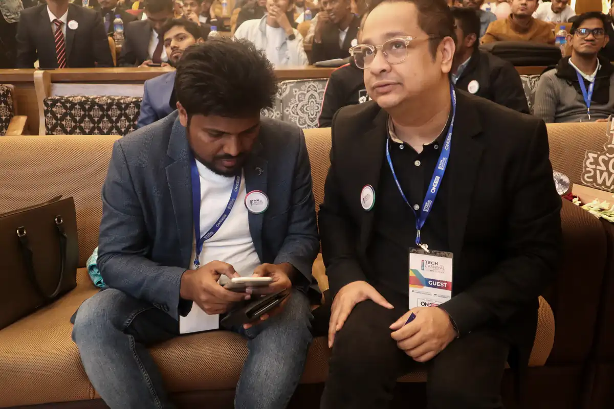 Abdul Mannan Zinnat seated next to Don Samdany at a conference