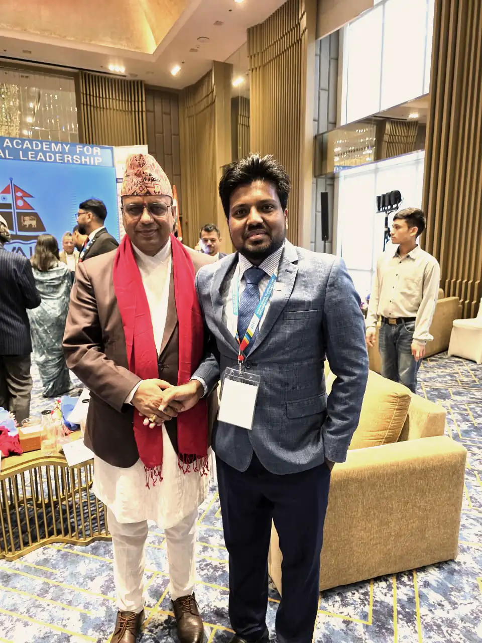 Abdul Mannan Zinnat standing with a senior guest at a leadership academy event
