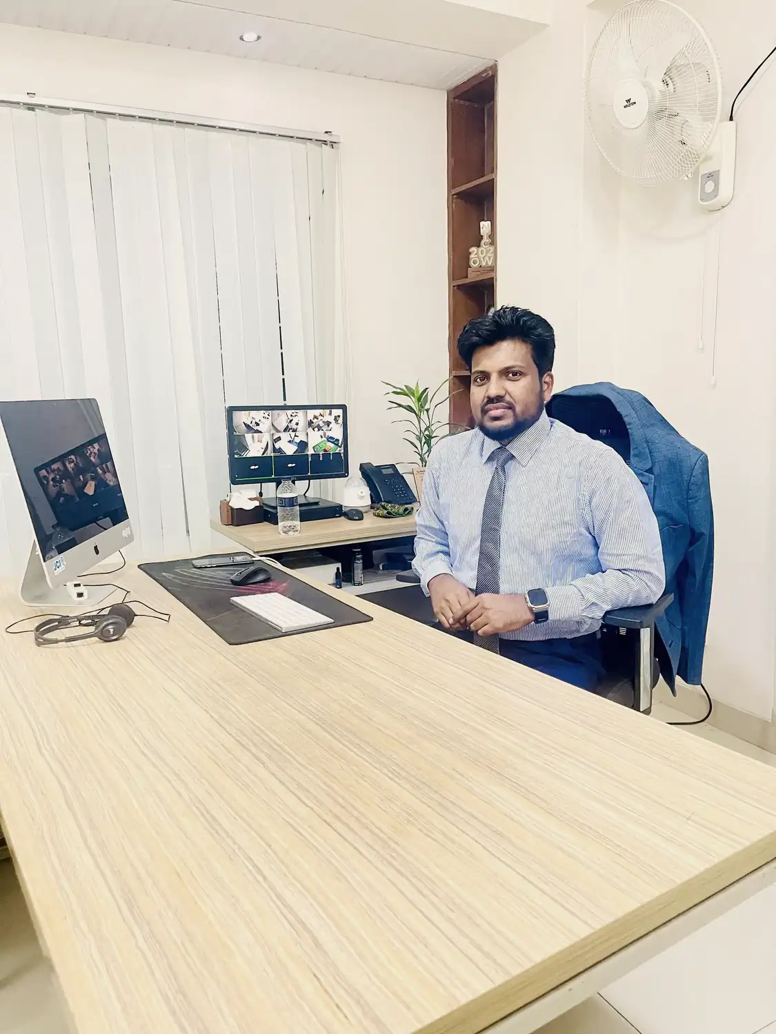 Abdul Mannan Zinnat seated at his office desk at SpaGreen Creative