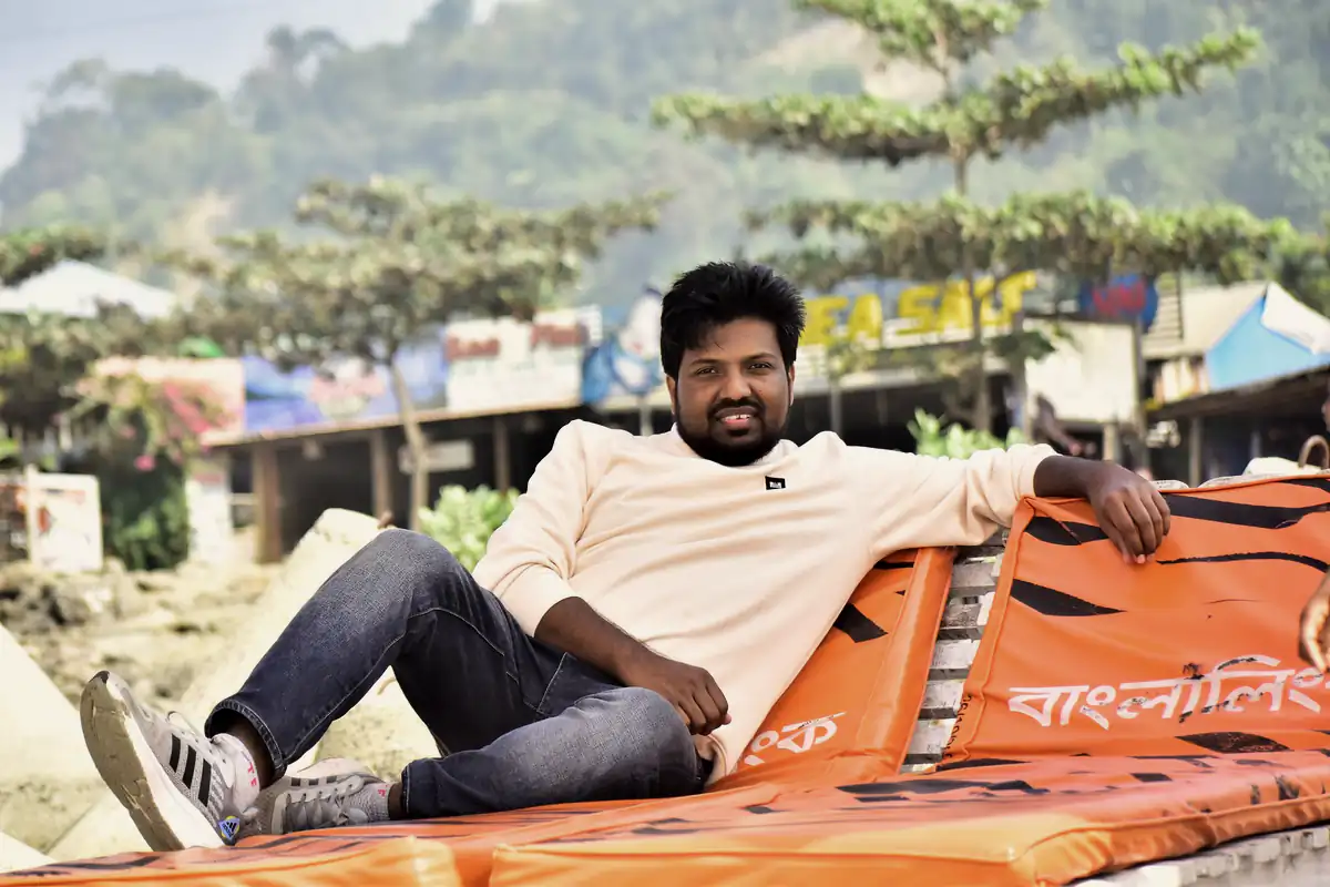 Abdul Mannan Zinnat resting on a beach lounger