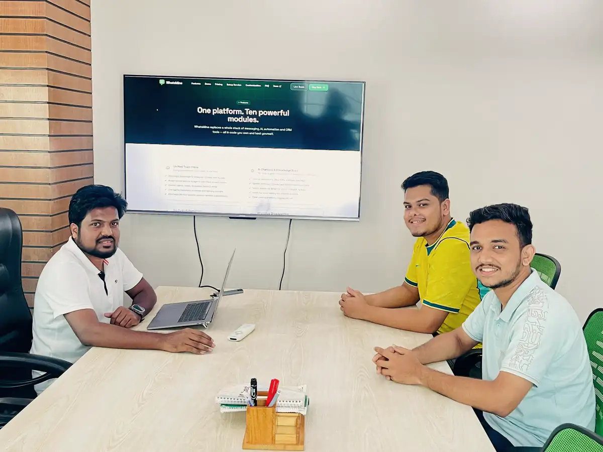 Abdul Mannan Zinnat and two teammates around a meeting table with a product page on screen