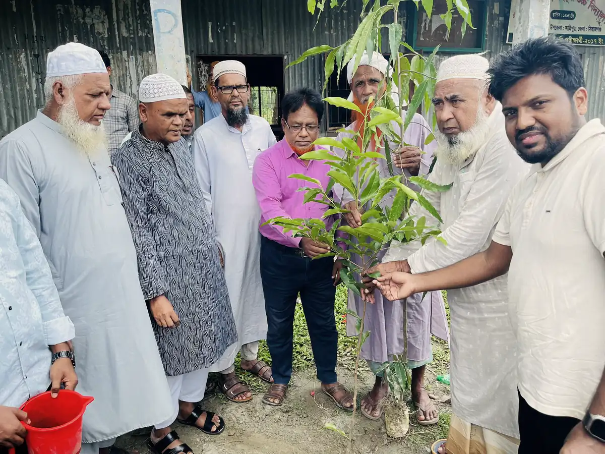 Abdul Mannan Zinnat and community elders planting a sapling together
